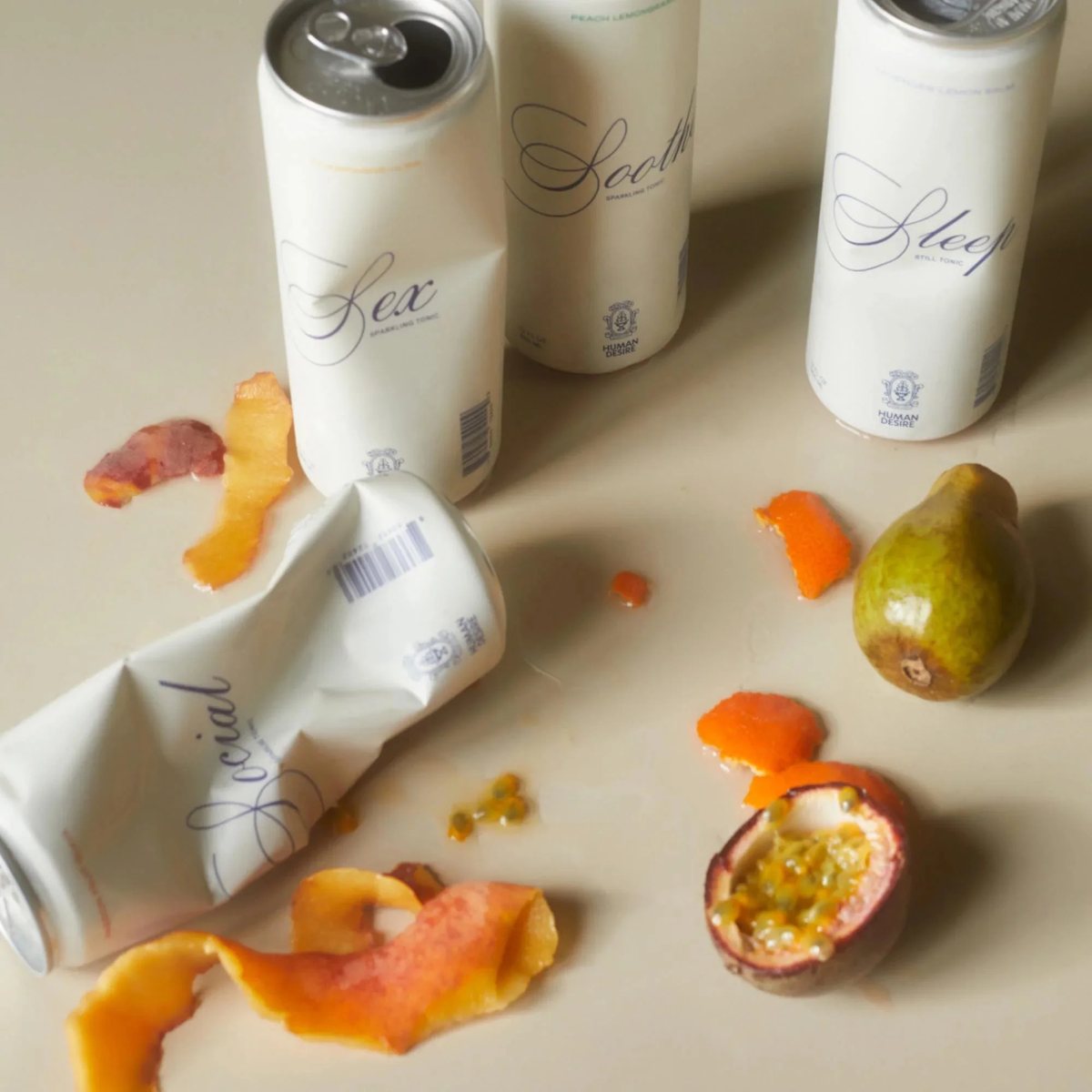 Human Desire cans among fruit peels and passion fruit