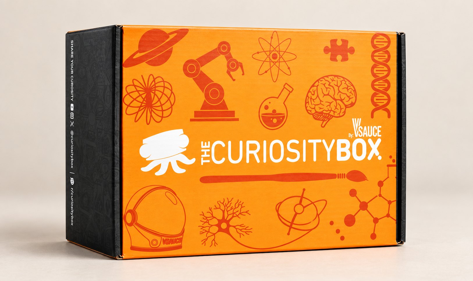 The Curiosity Box by Vsauce, an orange box covered in science illustrations