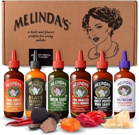 Melinda’s hot sauce gift box with six bottles: Thai sweet chili, black truffle, green sauce, fire roasted garlic and habanero, ghost pepper wing sauce, and Polynesian