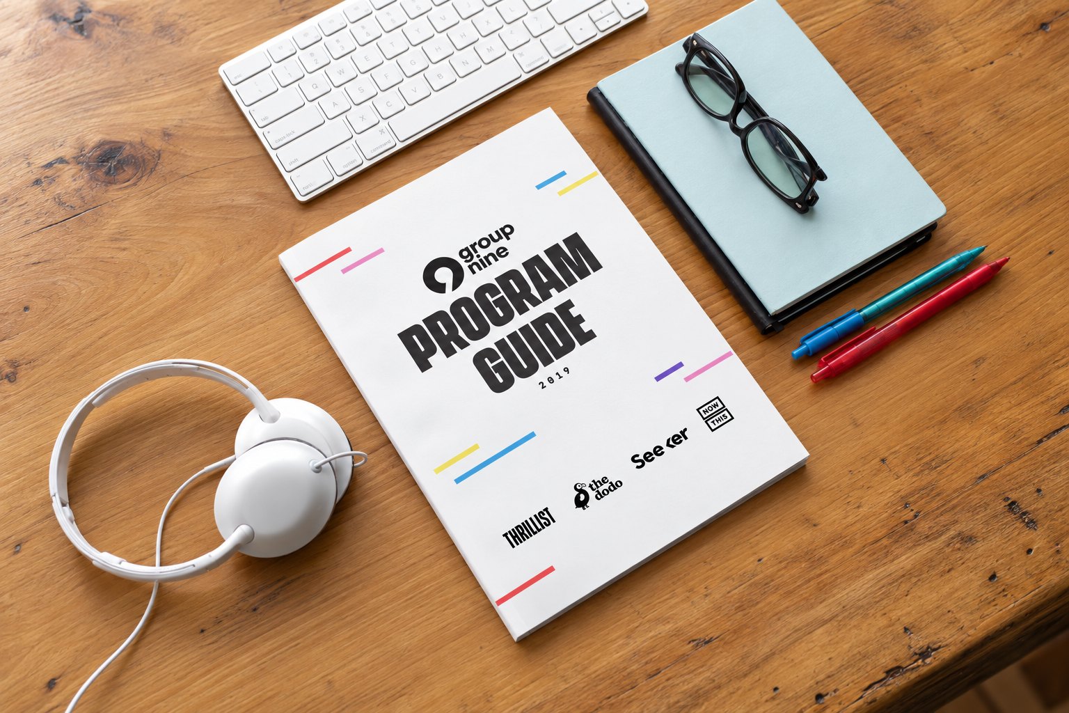 Group Nine Program Guide on a desk
