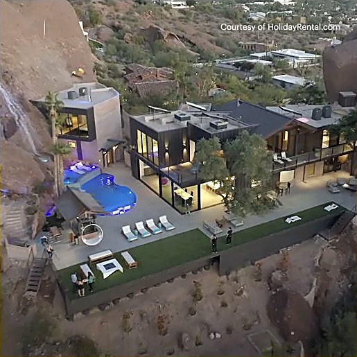 Aerial view of a luxury desert home with a pool