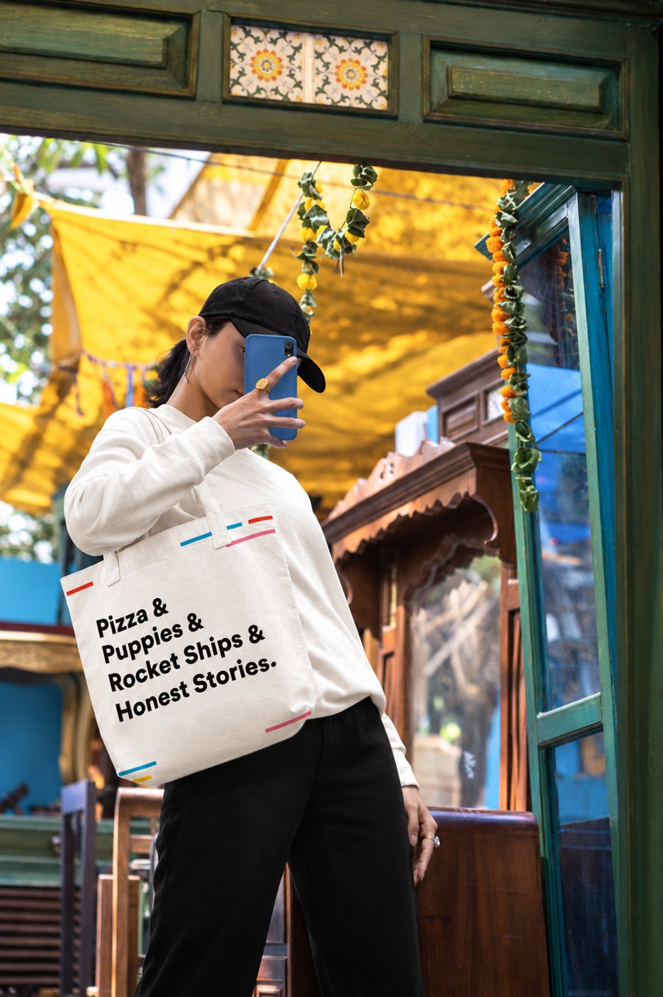 Woman carrying the Group Nine tote bag