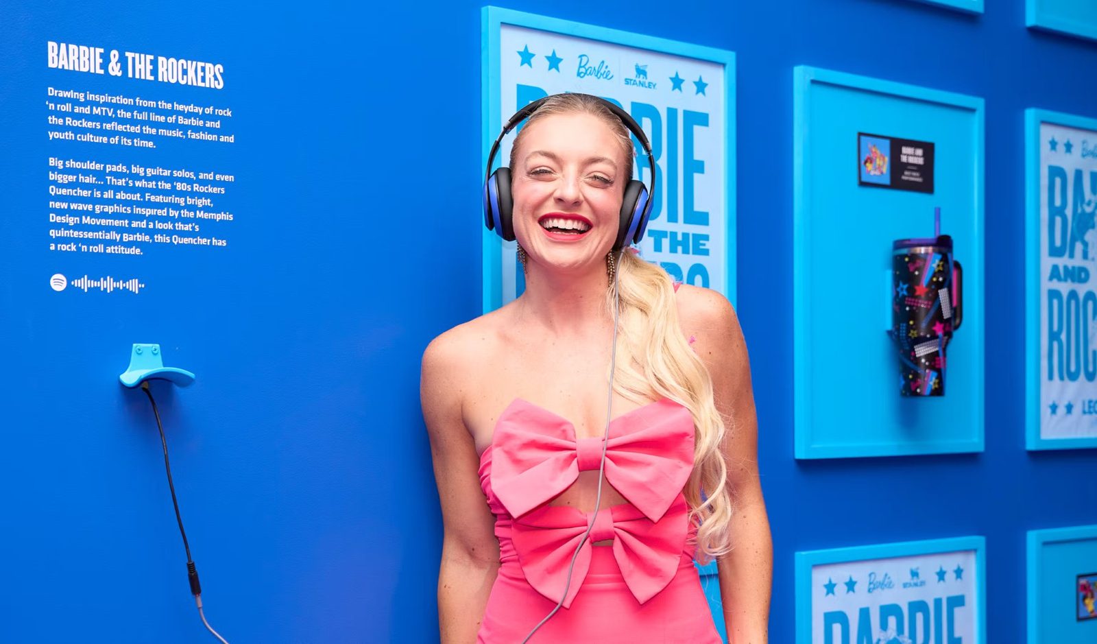 Guest in pink posing at the Barbie and the Rockers listening station