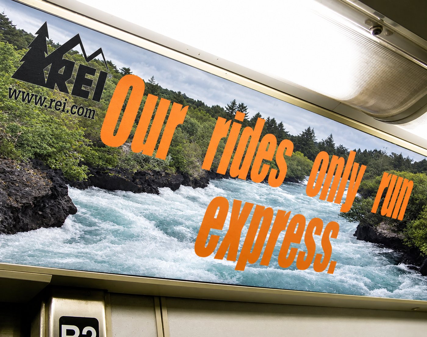 REI car card over whitewater: Our rides only run express.