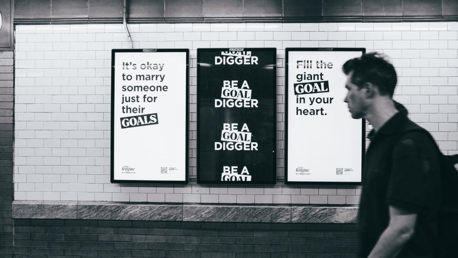 Three digital subway screens: It’s okay to marry someone just for their goals, Be a Goal Digger, and Fill the giant goal in your heart